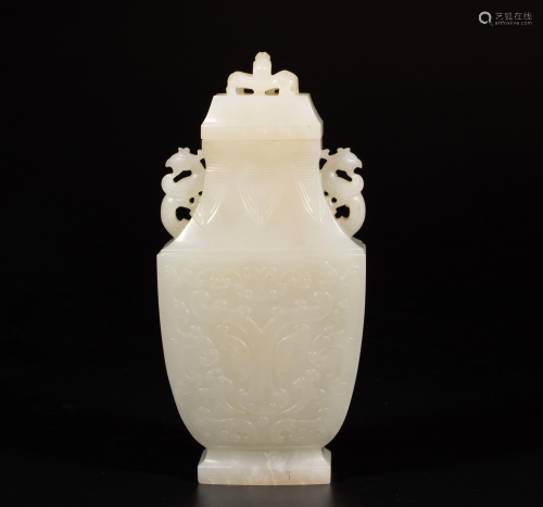 A CARVED WHITE JADE DOUBLE DRAGON EAR VASE