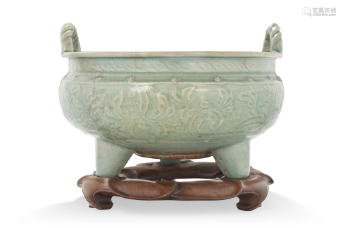 A LARGE LONGQUAN CELADON CARVED TRIPOD CENSER