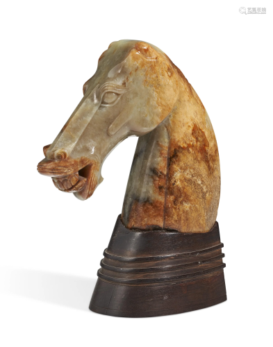 A RUSSET AND PALE GREEN JADE HAN-STYLE HORSE HEAD