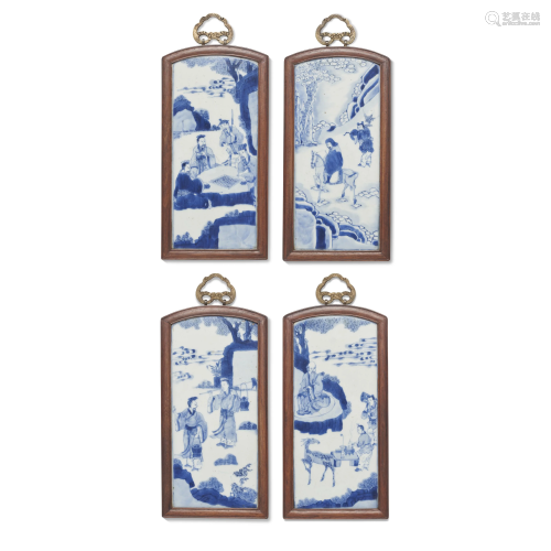 A SET OF FOUR BLUE AND WHITE FRAMED PLAQUES