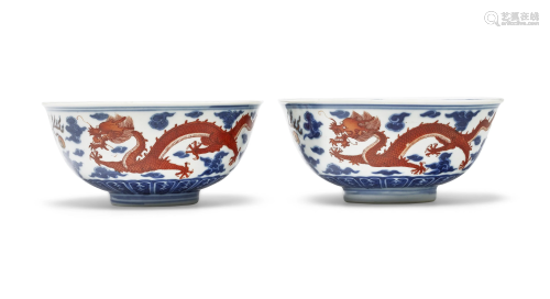 A PAIR OF IRON-RED AND BLUE AND WHITE `DRAGON' BOWLS