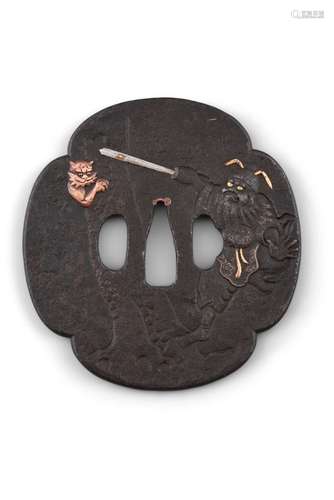 A LARGE WROUGHT-IRON 'SHOKI AND ONI' MOKKO GATA TSUBA Japan,...