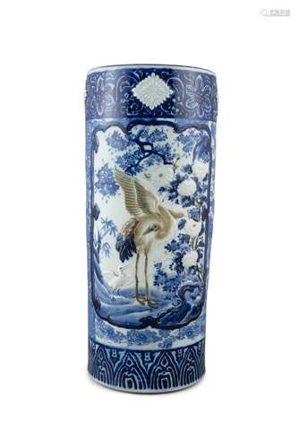 A LARGE MOULDED BLUE AND WHITE 'CRANE' PORCELAIN UMBRELLA ST...