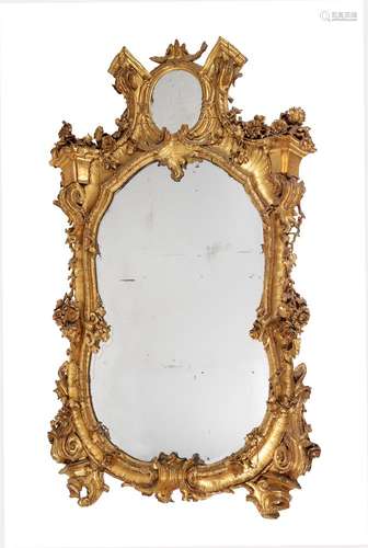 A CONTINENTAL CARVED GILTWOOD WALL MIRROR, 19TH CENTURY