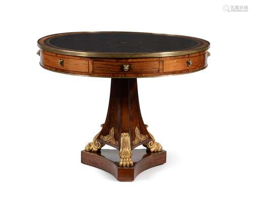 A REGENCY ROSEWOOD AND GILT BRASS MOUNTED DRUM LIBRARY TABLE...