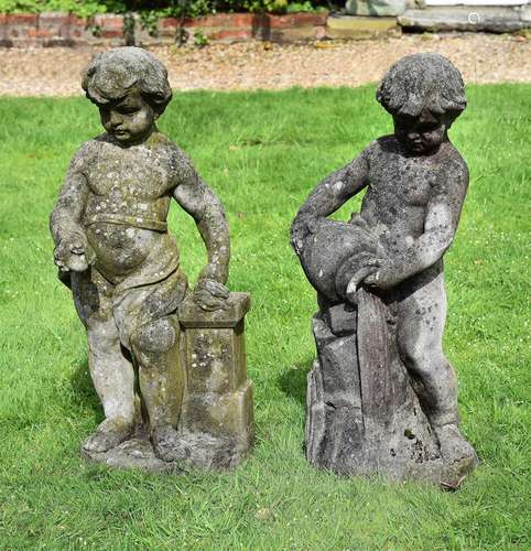 A PAIR OF COMPOSITION STONE CHERUBS EMBLEMATIC OF FIRE AND W...