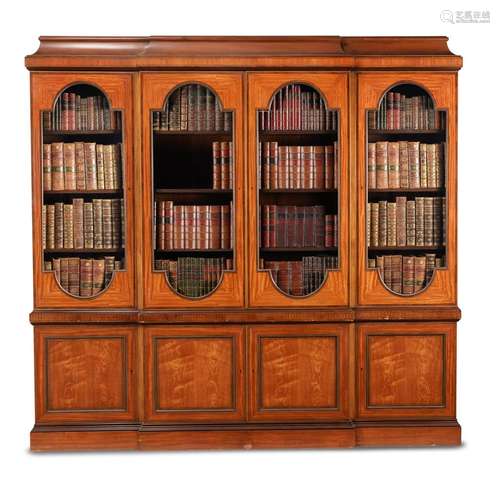 A SATINWOOD AND MAHOGANY CROSSBANDED BREAKFRONT LIBRARY BOOK...