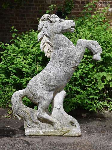 A COMPOSITION STONE MODEL OF A PRANCING HORSE, 20TH CENTURY