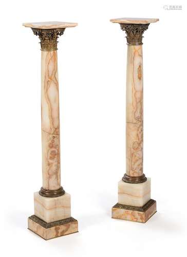 A PAIR OF FRENCH GILT METAL MOUNTED ONYX PEDESTAL COLUMNS, L...