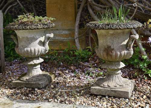 A PAIR OF CAST STONE CAMPANA VASES, ATTRIBUTED TO AUSTIN & S...