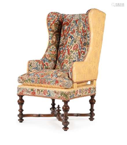 A WALNUT AND NEEDWORK UPHOLSTERED WING ARMCHAIR, 17TH CENTUR...