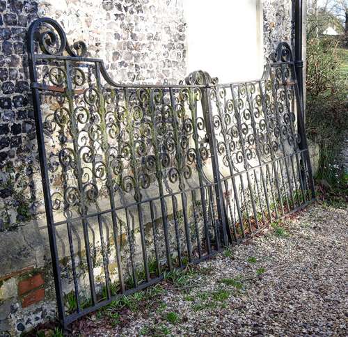 A PAIR OF BLACK PAINTED CAST AND WROUGHT IRON GATES, EARLY 2...