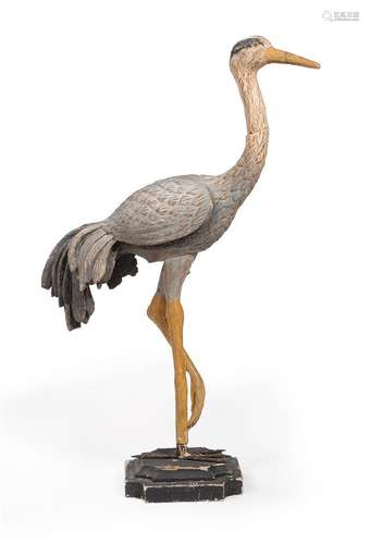 A CARVED WOOD & POLYCHROME PAINTED MODEL OF A WADING BIRD, M...