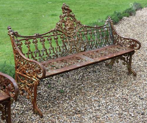 A CAST IRON BENCH IN THE COALBROOKDALE 'GOTHIC' PATTERN, LAT...