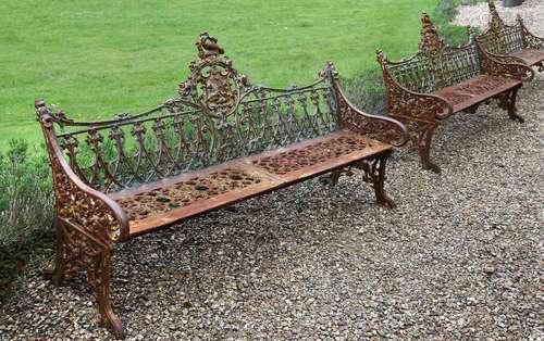 A PAIR OF CAST IRON BENCHES IN THE COALBROOKDALE 'GOTHIC' PA...