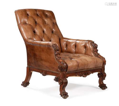 A VICTORIAN CARVED WALNUT AND BUTTONED LEATHER UPHOLSTERED L...