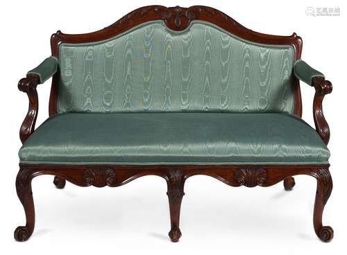 A GEORGE II WALNUT AND UPHOLSTERED SETTEE, CIRCA 1755