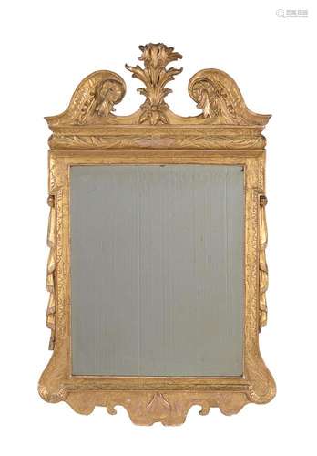 A GEORGE II GILTWOOD AND GESSO WALL MIRROR, CIRCA 1735, IN T...