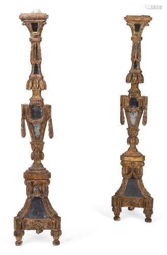 A PAIR OF CONTINENTAL GILTWOOD ALTAR STICKS, SECOND HALF 18T...