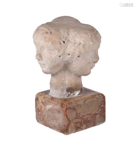 AN UNUSUAL CARVED MARBLE VULTUS TRIFRONS OR THREE FACED CAPI...