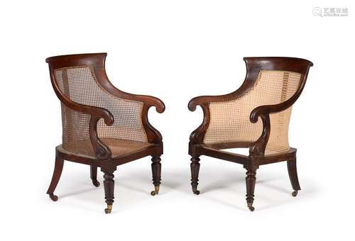 A MATCHED PAIR OF WILLIAM IV MAHOGANY BERGERE LIBRARY ARMCHA...