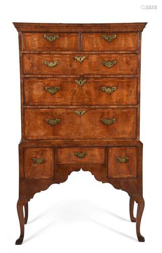 A GEORGE I WALNUT AND FEATHER BANDED CHEST ON STAND, CIRCA 1...