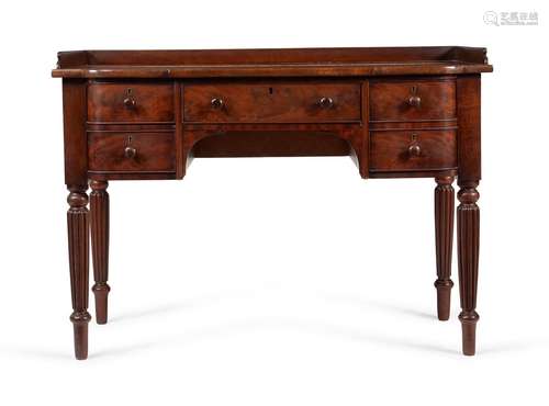 A GEORGE IV MAHOGANY AND EXOTIC HARDWOOD DRESSING TABLE, CIR...