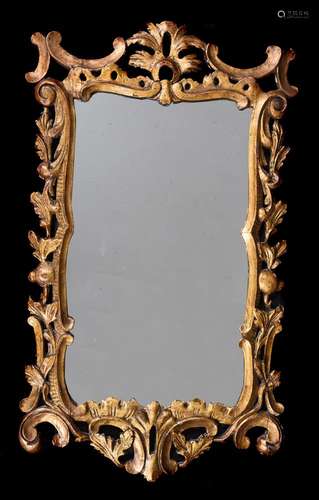 A GEORGE II CARVED GILTWOOD WALL MIRROR, CIRCA 1750