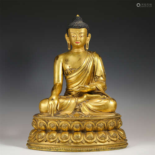 A CHINESE GILT BRONZE SEATED FIGURE OF SAKYAMUNI