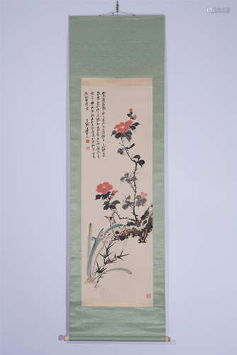 A CHINESE SCROLL PAINTING OF FLOWERS WITH INSCRIPTION