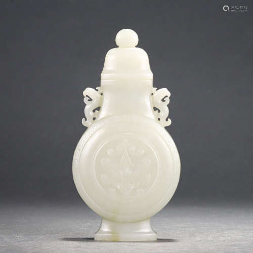 A CHINESE WHITE JADE VASE WITH DOUBLE HANDLES & A COVER