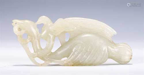 A CHINESE CARVED JADE MYTHICAL BEAST DECORATION