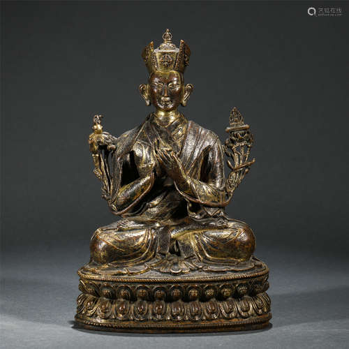 A CHINESE GILT BRONZE SEATED FIGURE OF BUDDHA