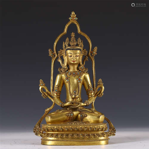 A CHINESE GILT SEATED FIGURE OF BUDDHA