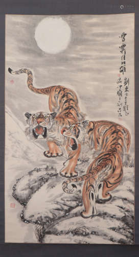 A CHINESE PAINTING DEPICTING TWO ROARING TIGERS