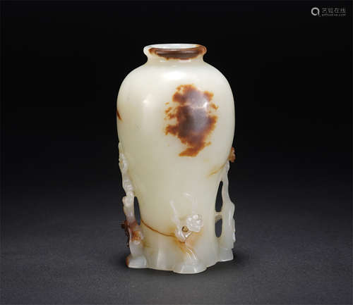 A CHINESE WHITE JADE CARVED FLORAL VASE