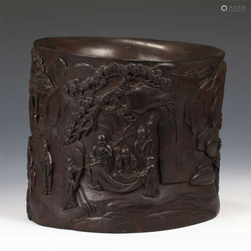 A CHINESE CARVED HARDWOOD FIGURAL BRUSH POT