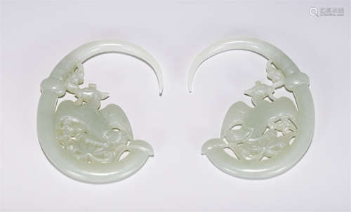 A PAIR OF CHINESE CARVED JADE MYTHICAL BEAST DECORATIONS