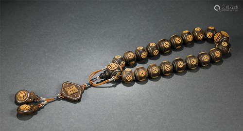 A CHINESE GILT CHENXIANG WOOD PRAYER BEADS