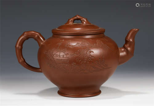 A CHINESE INSCRIBED YIXING CLAY LANDSCAPE TEA POT