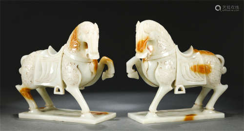 A PAIR OF CHINESE CARVED JADE HORSES