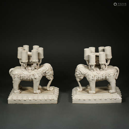 A pile of white porcelain candlesticks from Ding ware of Lia...