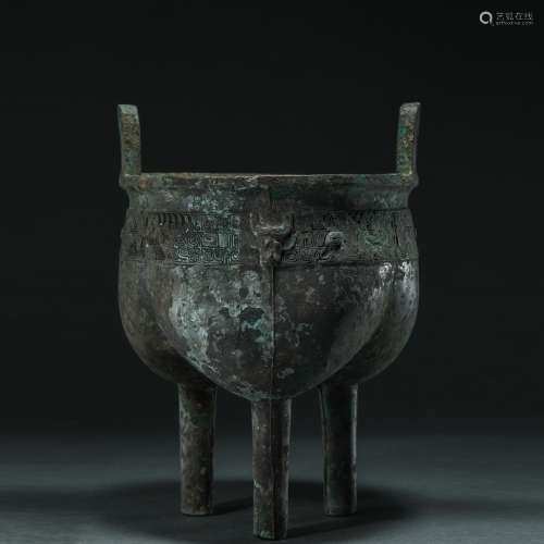 LATE SHANG DYNASTY, BRONZE TRIPOD DING WITH ANIMAL FACE