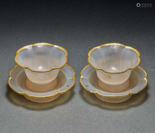 A PAIR OF AGATE CUP AND SAUCER, RIM COVERD GOLD, LIAO AND JI...
