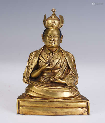 A CHINESE GILT BRONZE STATUETTE OF GURU