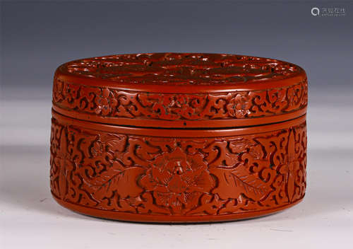 A CHINESE CARVED RED LACQUER FLORAL BOX AND COVER