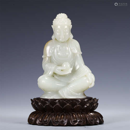 A CHINESE CARVED JADE SEATED FIGURE OF BUDDHA GUANYIN