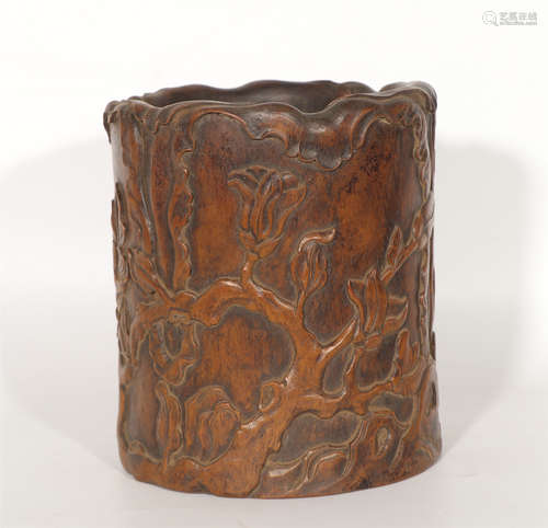 A CHINESE HUANGHUALI BRUSH POT CARVED WITH FLOWERS