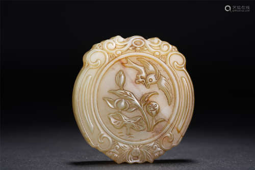 A CHINESE JADE CARVED FLOWER-BIRD PENDANT