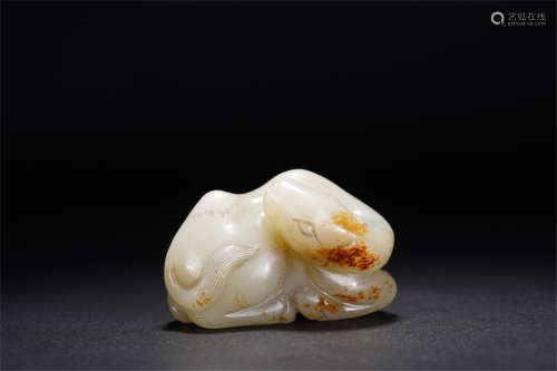 A CHINESE CARVED WHITE JADE CAMEL PENDANT